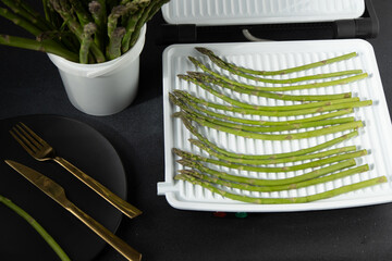 Bunch of green asparagus. Fresh spring vegetable food on grill.