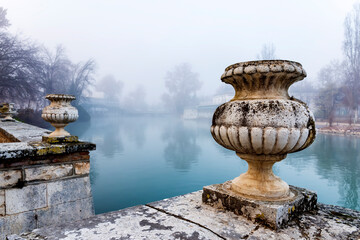 Historic flower pots and fog at river Tagus in Aranjuez.  Madrid. Spain. Europe.