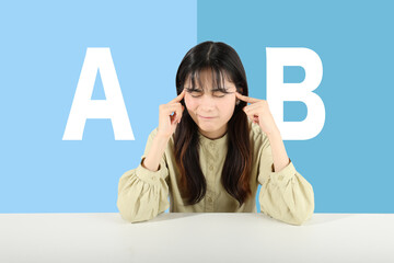 AかBか、どちらか悩む若い女性　ブルー