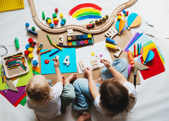 Children drawing and making crafts in kindergarten or daycare. - 791548818