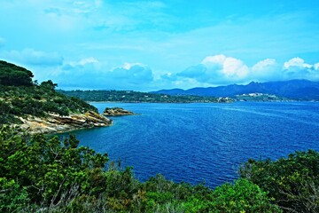 Fototapeta na wymiar Italy-view on the seacoast and town Porto Azzurro on the island of Elba