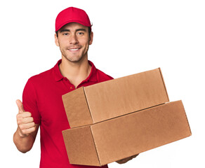 Young Hispanic delivery man with boxes smiling and raising thumb up