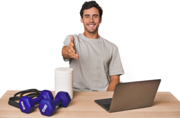 Hispanic trainer planning workout stretching hand at camera in greeting gesture.