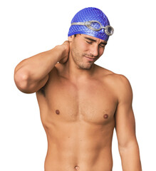 Young Hispanic man with swim gear suffering neck pain due to sedentary lifestyle.