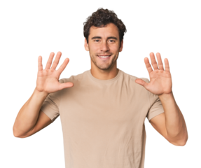 Young Hispanic man in studio showing number ten with hands.