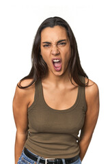 Hispanic young woman shouting very angry, rage concept, frustrated.