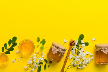 honey jar with acacia flowers and leaves. fresh honey top view flat lay