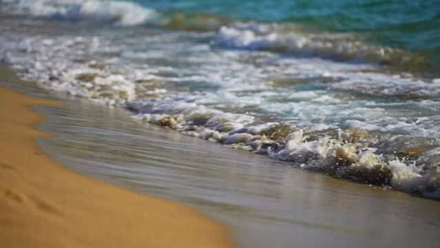 Tropic sea waves on the beach.