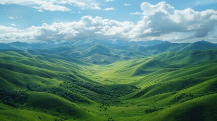 Green valley with distant mountains