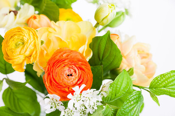 Elegant mixed warm colored spring bouquet close up. Spring flowers.