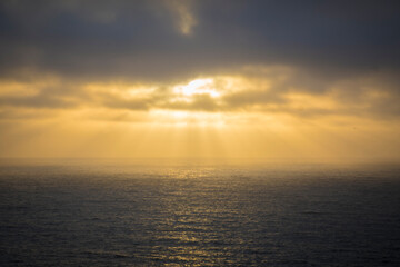 Golden Sunset Rays Over Calm Seascape