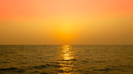 Sea view for summer vacation concept Nature of the summer beach and sea with soft sunlight. hitting the sand The sea sparkles against the sunset sky.	