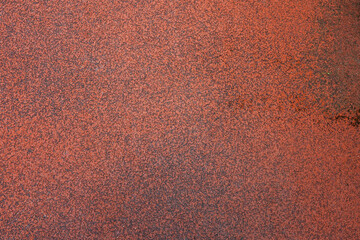 Red surface made of pressed rubber crumb.
