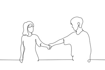 man and woman holding hands looking at each other - one line art vector. concept lovers on a walk, going through life together