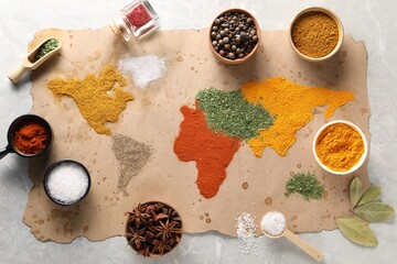 World map of different spices and products on light grey marble table, top view