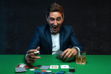 The lucky poker player rejoices at his victory and cannot contain his emotions.