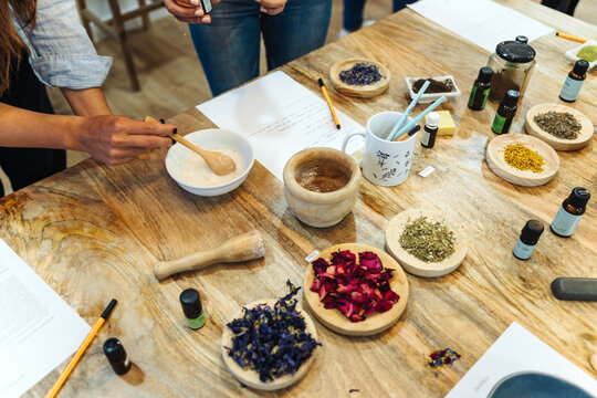 Woman grinding ingredients to create a natural hypoallergenic soap