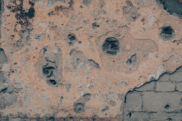 explosion-damaged wall of the house of the war in Ukraine