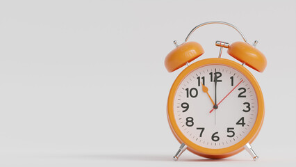 Yellow alarm clock on white background. The clock hand shows 11 o'clock