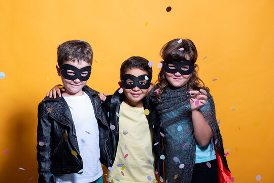 Children in superhero masks enjoying a costume party