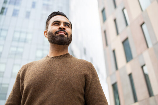 Urban man contemplating in a city setting