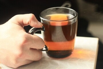 A man drinks hot tea