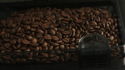 Roasted coffee beans in a coffee machine