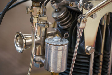Close up and detail of a vintage motorcycle. Single cylinder engine. Selective focus.