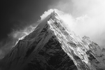 A black and white image of a mountain peak, accentuating its stark beauty.