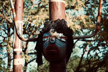 mask on a tree sculpture film photography art