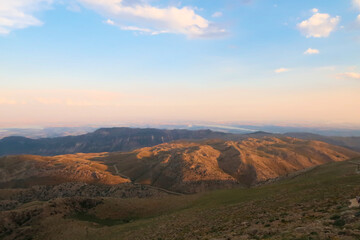 View from Mount Nemrut onto the surrounding landscape before sunset, the Atatürk Reservoir is...