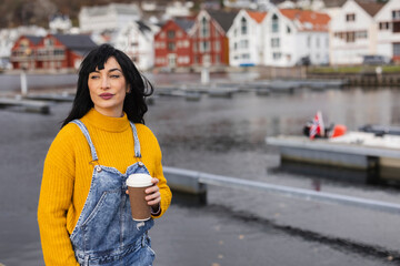 Stylish Woman with Coffee Enjoying the Harbor View