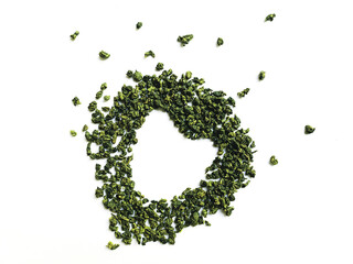Dry pressed tea leaves on a white background.