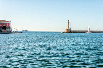 Lighthouse with old Venetian harbor in Chania city on Crete island, Greece.