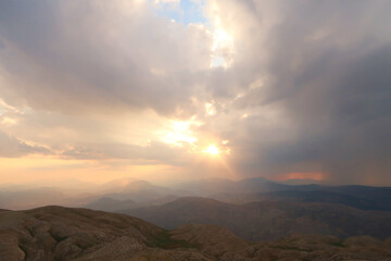View from Mount Nemrut onto the surrounding landscape before sunset on a cloudy day, close to...