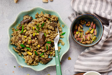 Turkish pilaf with chicken liver and pistachios - 791610271
