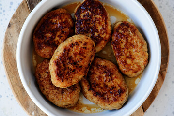 Chicken cutlets in a frying pan. top veiw - 791611028