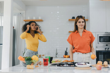 Pride LGBT Family at the kitchen Happy face. Preparing family dinner at home. Happy smiling family having fun cooking at kitchen together. Family lifestyle. Happy together cooking on kitchen.