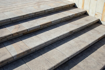 Stairs corner, in the sun with tree shadows, abstract texture backdrop