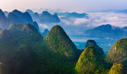 Aerial view of the beautiful karst mountains and cloud natural landscape at sunrise in Guilin,...