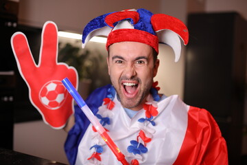Patriotic French sports fan celebrating a victory 