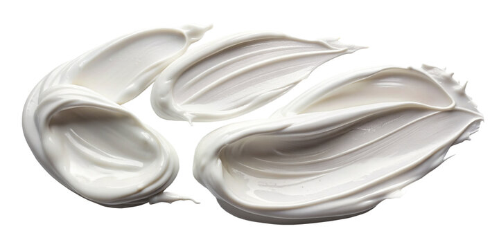 Swirls of white cosmetic cream smears, luxuriously textured and isolated on a transparent background, perfect for beauty and skincare product layouts.