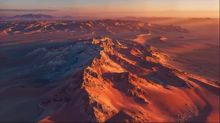 Fotobehang an aerial view of a desert landscape at sunset © gn8