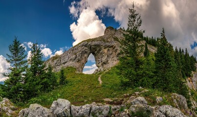 Rocky window, Ohniste, Low Tatras mountains, mountain landscape with big rock Slovak republic. Hiking theme. Seasonal natural scene.