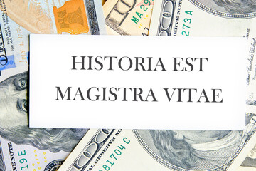 Historia est vitae magistra (History is the tutor of life) Latin phrase on a white business card...