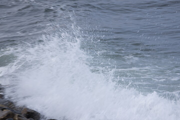 Ocean waves splashing on a rocky shore