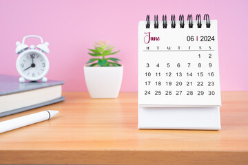 June Mini desk calendar for 2024 year on worktable.
