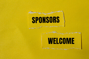 Sponsors welcome words written on ripped yellow paper pieces with yellow background. Conceptual...