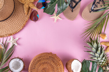 Summer vacation and travel holiday background, sale and invitation flat lay, with tropical leaves, flip flops, straw hat, sunglasses and bag, coconut and pineapple tropical sweet fruits. 