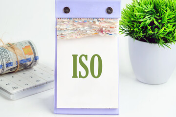 ISO. International Organization for Standardization. A Word ISO It is written on a piece of desktop calendar on a white background